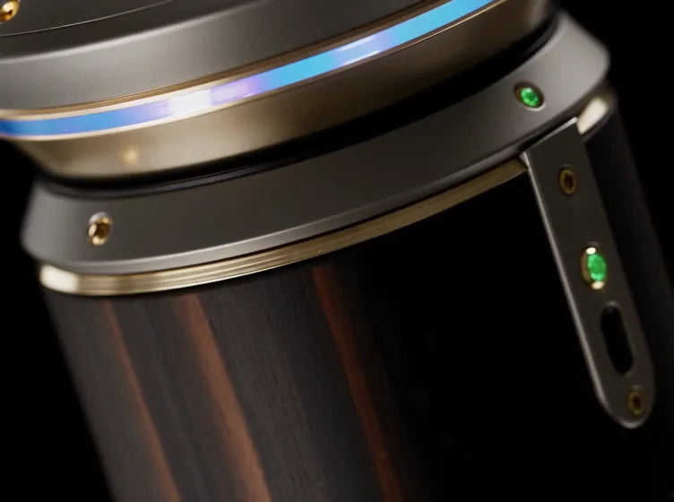 The ATUM diffuser up close: wood body, metal cap, the blue light ring